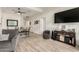 Bright living room featuring modern flooring, open to the dining area and kitchen at 11779 E Becker Ln, Scottsdale, AZ 85259