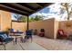 Private backyard patio with decorative seating, pavers, and sun decor at 11779 E Becker Ln, Scottsdale, AZ 85259