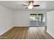 Open living room with sliding glass doors that open up to the backyard at 12037 S Bannock St, Phoenix, AZ 85044