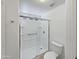 Modern bathroom features a glass enclosed shower with white subway tile and chrome fixtures at 12037 S Bannock St, Phoenix, AZ 85044