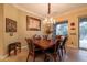 Formal dining room featuring a chandelier, decorative art, and a view to an outdoor space at 12572 W Jasmine Trl, Peoria, AZ 85383