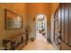 A stylish foyer featuring tile floors, an arched doorway, and elegant decor at 12572 W Jasmine Trl, Peoria, AZ 85383