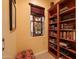 Hallway with built in bookcase and stained glass window at 12572 W Jasmine Trl, Peoria, AZ 85383