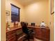 Home office with built-in desk, ample storage, and natural light at 12572 W Jasmine Trl, Peoria, AZ 85383