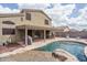 Backyard with covered patio, outdoor seating, grill, and private pool at 14406 N 129Th Ave, El Mirage, AZ 85335