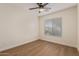 Well-lit bedroom featuring modern flooring and a ceiling fan at 14838 N 172Nd Ln, Surprise, AZ 85388