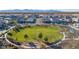 Aerial view of a park in a neighborhood offering green spaces and playground for community enjoyment at 15289 W Valentine St, Surprise, AZ 85379