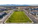 Large, green community park with picnic benches and shade structures in a neighborhood at 15289 W Valentine St, Surprise, AZ 85379