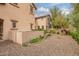 View of backyard featuring gravel landscaping and privacy wall between homes at 15289 W Valentine St, Surprise, AZ 85379