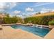 Sparkling pool with mature privacy hedges and easy access to the main house at 15289 W Valentine St, Surprise, AZ 85379