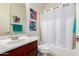 Bathroom featuring a single sink vanity, tiled floors, and shower tub combo at 15289 W Valentine St, Surprise, AZ 85379