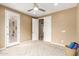 Bedroom featuring large windows, neutral walls, and a ceiling fan at 15289 W Valentine St, Surprise, AZ 85379