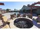 Outdoor gathering space featuring a fire pit surrounded by cushioned chairs, offering a cozy spot for relaxation at 15289 W Valentine St, Surprise, AZ 85379