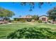 Community clubhouse with large lawn perfect for outdoor activities and community events at 15289 W Valentine St, Surprise, AZ 85379