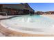 Zero entry community pool with fountains and lounge seating at 15289 W Valentine St, Surprise, AZ 85379