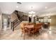 Elegant dining area with a wooden table, and stairs visible at 15289 W Valentine St, Surprise, AZ 85379