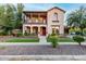 Inviting two-story home features a balcony, landscaped yard, and charming curb appeal at 15289 W Valentine St, Surprise, AZ 85379