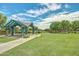 Community gazebo providing shaded seating and a pleasant area to relax with large grassy area at 15289 W Valentine St, Surprise, AZ 85379