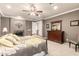 Comfortable main bedroom with a fireplace, dresser, soft lighting, and neutral decor for a relaxing atmosphere at 15289 W Valentine St, Surprise, AZ 85379