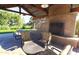 Comfortable outdoor lounge with a cozy fireplace and cushioned seating at 15289 W Valentine St, Surprise, AZ 85379