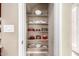 Organized pantry with shelving providing ample storage space for kitchen essentials at 15289 W Valentine St, Surprise, AZ 85379