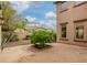 Cozy patio with potted tree, and rock landscaping at 15289 W Valentine St, Surprise, AZ 85379