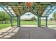 Pavilion view of well-maintained green space and the community clubhouse at 15289 W Valentine St, Surprise, AZ 85379