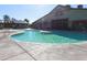 Community pool featuring crystal clear water and a covered seating area, perfect for relaxing and socializing at 15289 W Valentine St, Surprise, AZ 85379