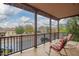 Covered porch featuring metal railings and comfortable chairs at 15289 W Valentine St, Surprise, AZ 85379