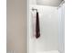 Modern shower stall featuring a towel rack and a shower curtain for privacy at 15289 W Valentine St, Surprise, AZ 85379