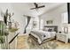 Bedroom showcasing a plush rug, patterned bedding, and natural light at 16987 W Princeton Ave, Goodyear, AZ 85395