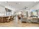 Open-concept living room featuring hardwood floors, stylish furnishings, and abundant natural light at 16987 W Princeton Ave, Goodyear, AZ 85395