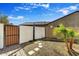 An outdoor shower next to a private patio, perfect for cooling off on hot days, and accessible from the pool at 16987 W Princeton Ave, Goodyear, AZ 85395