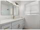 Bright bathroom featuring double mirrors, quartz countertop, and brass hardware at 1810 N 12Th St, Phoenix, AZ 85006