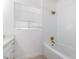 Bright bathroom featuring subway tiles, updated fixtures, and tub at 1810 N 12Th St, Phoenix, AZ 85006