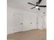 Bright bedroom with neutral flooring, modern ceiling fan, and two closets at 1810 N 12Th St, Phoenix, AZ 85006