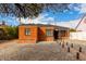 Lovely brick house with dark windows and roof, complemented by a low maintenance front yard at 1810 N 12Th St, Phoenix, AZ 85006