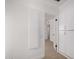 Hallway featuring laminate floors and white doors at 1810 N 12Th St, Phoenix, AZ 85006