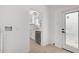 Bright laundry area and updated kitchen featuring white cabinets, quartz countertops, and stainless steel appliances at 1810 N 12Th St, Phoenix, AZ 85006