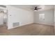 Light and airy living room showcasing vinyl plank flooring, white paint, and modern fan at 1810 N 12Th St, Phoenix, AZ 85006