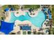 Aerial view of a resort-style community pool, cabanas, and a recreational area at 18182 W Glenhaven Dr, Goodyear, AZ 85338