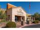 Attractive community clubhouse featuring stone accents and desert landscaping in a retirement neighborhood at 18182 W Glenhaven Dr, Goodyear, AZ 85338