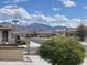 Picturesque neighborhood street view with mountain backdrop, desert landscaping, and well-maintained homes at 18182 W Glenhaven Dr, Goodyear, AZ 85338