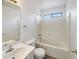 Standard bathroom with tub/shower combo, white tile surround, and single sink vanity with storage at 1940 W Oriole Way, Chandler, AZ 85286