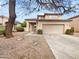 Charming two-story home with a well-maintained front yard and attached two-car garage at 1940 W Oriole Way, Chandler, AZ 85286