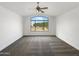 Spacious main bedroom with new carpet, a ceiling fan, and a view of neighborhood at 1940 W Oriole Way, Chandler, AZ 85286