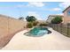 Backyard pool featuring natural rock landscaping, a fenced perimeter, and proximity to the main house at 1940 W Oriole Way, Chandler, AZ 85286