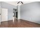 This is a bedroom featuring hardwood floors, a closet, and light blue walls at 2035 S Elm St # 218, Tempe, AZ 85282