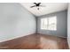 An empty bedroom featuring hardwood floors and light blue walls at 2035 S Elm St # 218, Tempe, AZ 85282