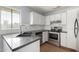 Well-lit kitchen with stainless steel oven and appliances, and white cabinets at 2035 S Elm St # 218, Tempe, AZ 85282